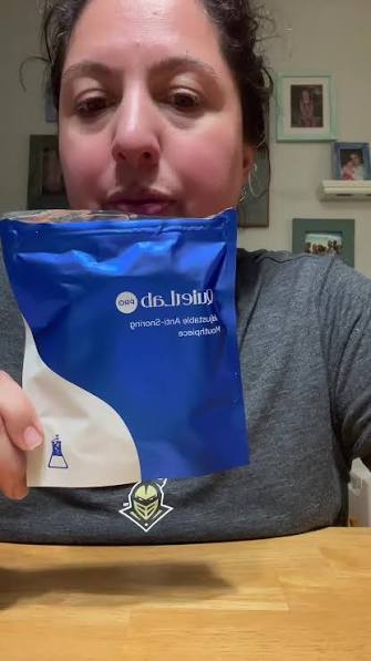 Woman holding a QuietLab Pro package